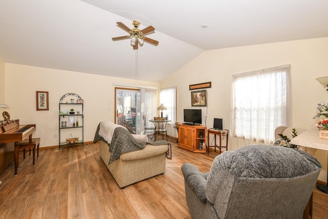 living room with vaulted ceiling, light hardwood / wood-style flooring, a wealth of natural light, and ceiling fan