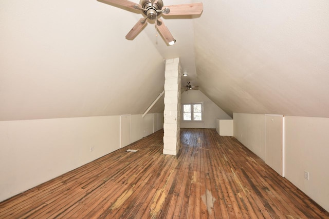 bonus room featuring dark hardwood / wood-style flooring, ceiling fan, and lofted ceiling