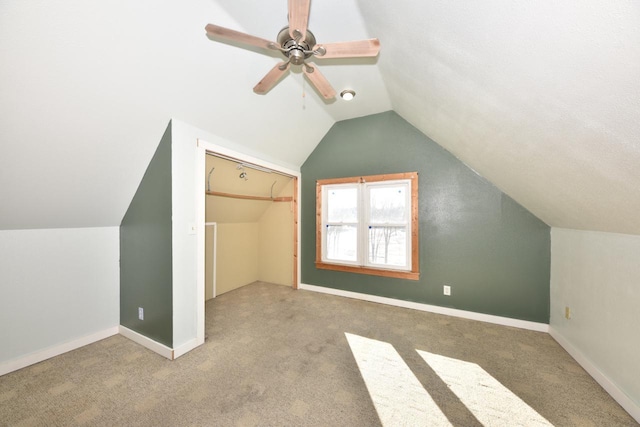 bonus room with carpet, ceiling fan, and lofted ceiling