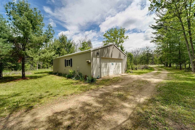 exterior space featuring a yard and a garage