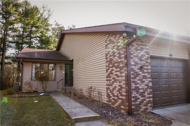 view of side of property with a garage