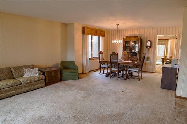 carpeted dining space with a chandelier