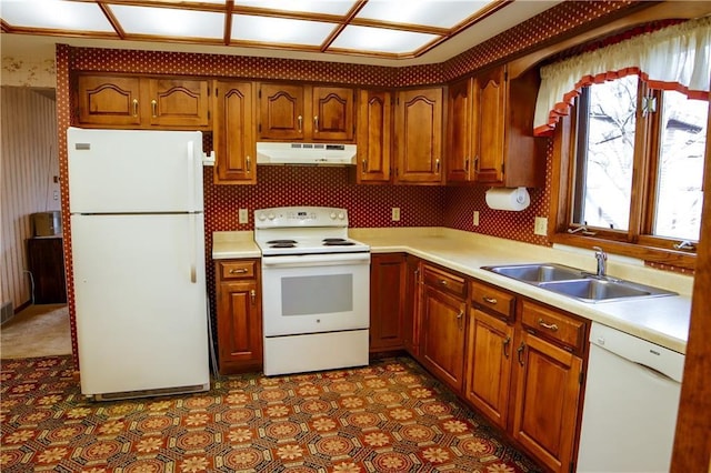 kitchen featuring white appliances and sink