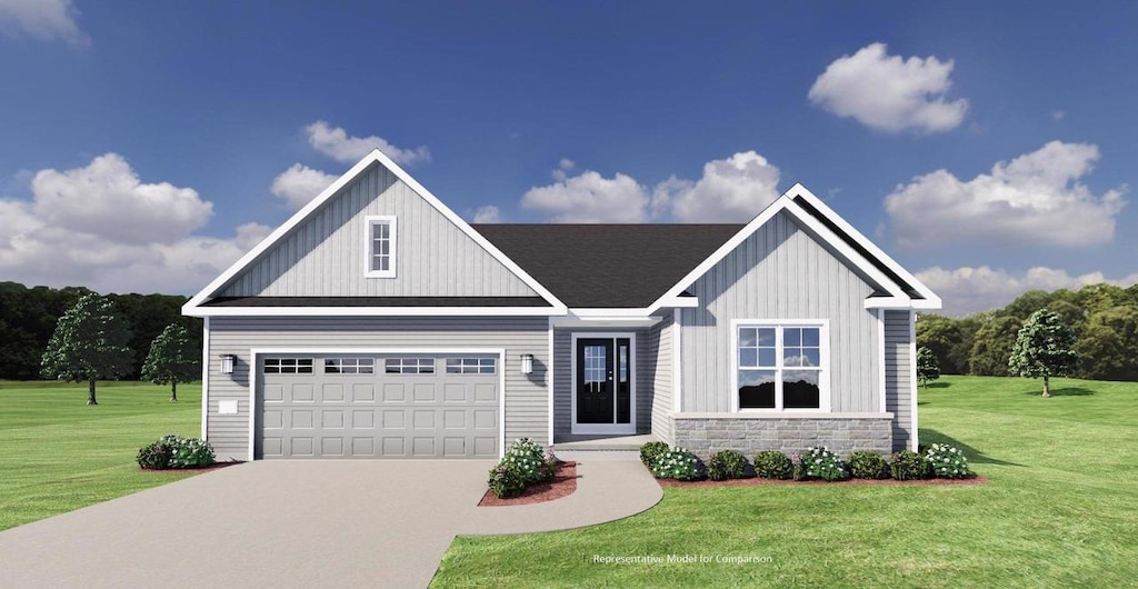 view of front facade with a front yard and a garage