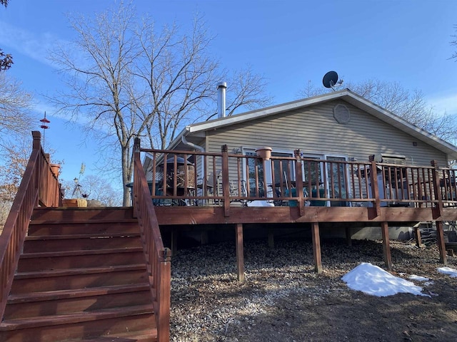 back of house with a wooden deck