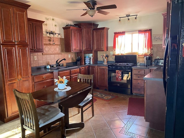 kitchen with black appliances, sink, ceiling fan, light tile patterned floors, and tasteful backsplash