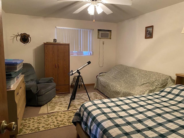 bedroom with a wall unit AC and ceiling fan