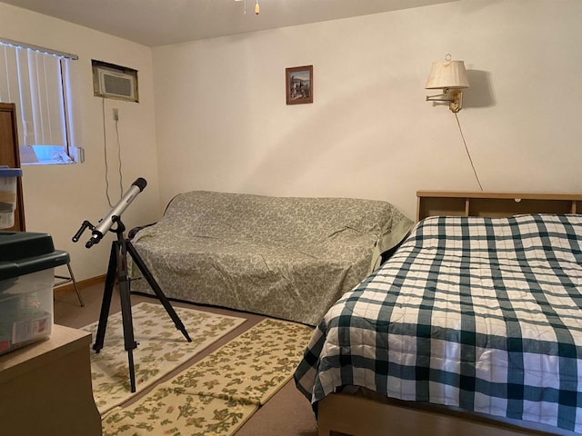 bedroom featuring a wall mounted AC