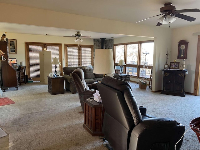 living room with ceiling fan and light colored carpet