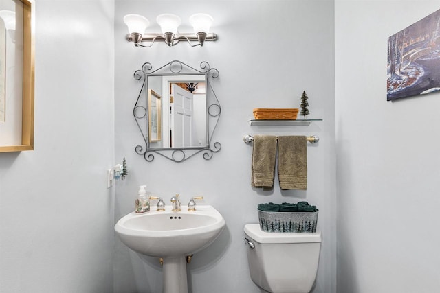 bathroom with toilet and sink