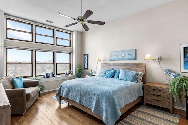 bedroom featuring hardwood / wood-style floors and ceiling fan