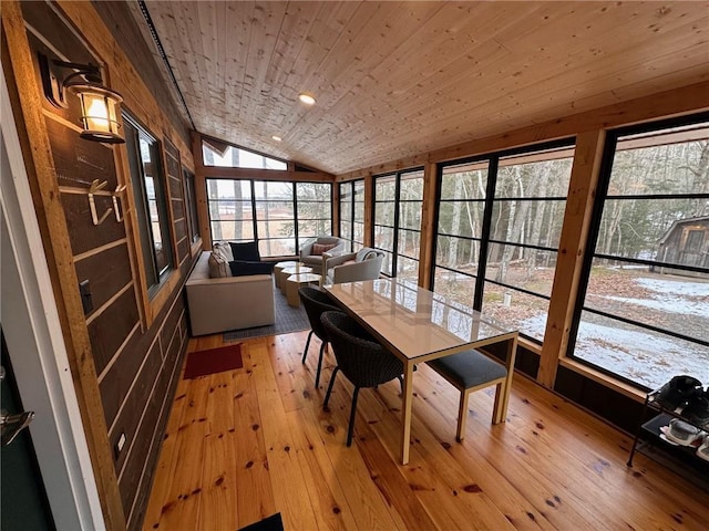 sunroom / solarium featuring lofted ceiling, a wealth of natural light, and wooden ceiling