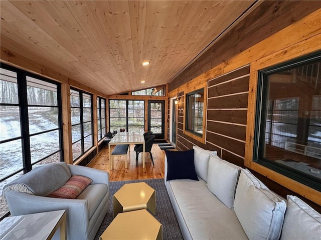 sunroom / solarium with lofted ceiling and wood ceiling