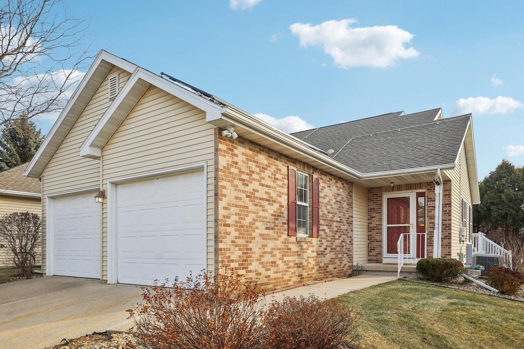 ranch-style house featuring a garage