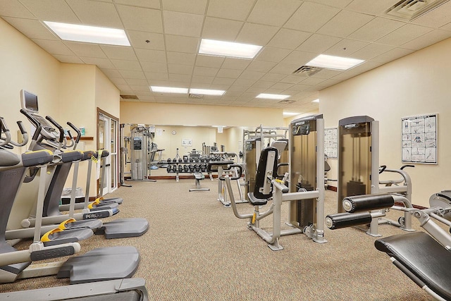 gym featuring a paneled ceiling