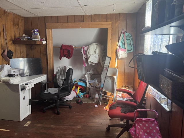 office featuring wood walls and dark hardwood / wood-style flooring