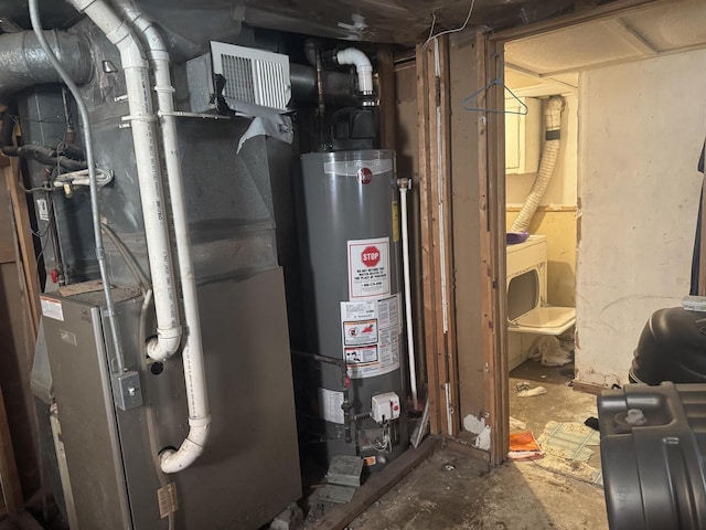 utility room featuring heating unit and water heater