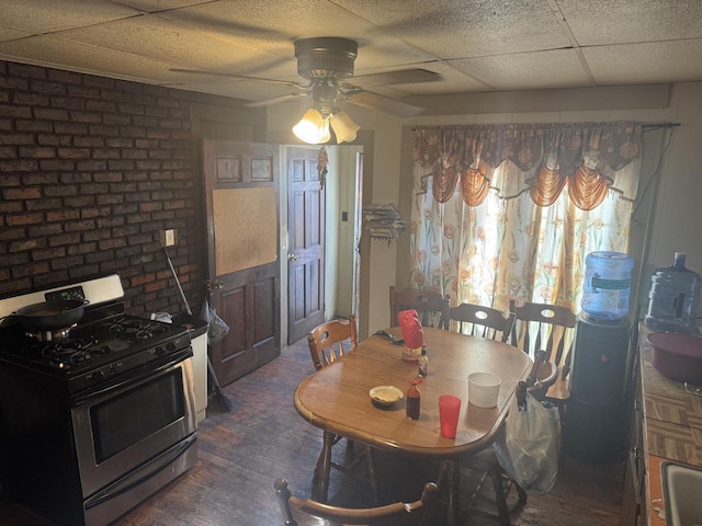 dining room featuring a drop ceiling and ceiling fan