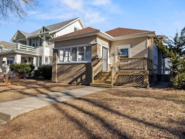 view of front of property with a balcony