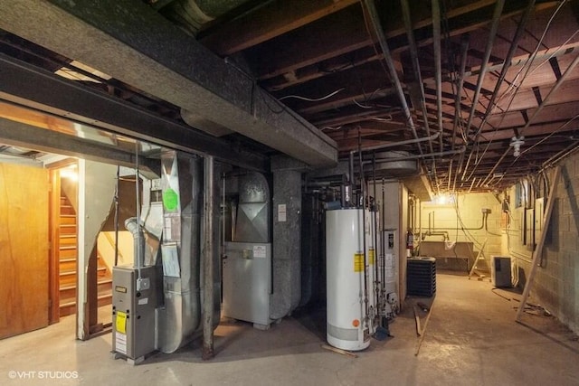 basement featuring heating unit and gas water heater