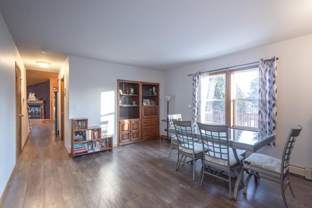 dining space featuring dark hardwood / wood-style flooring