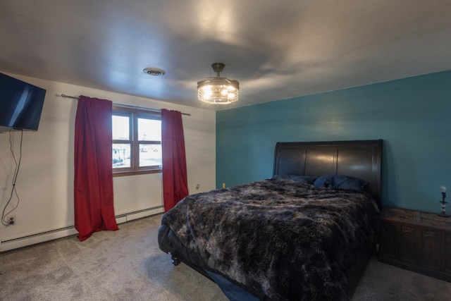 carpeted bedroom with a baseboard radiator