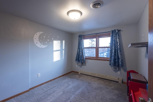 carpeted empty room featuring a baseboard radiator