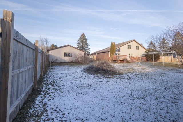 view of yard layered in snow