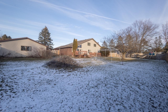 snowy yard with a playground