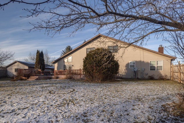 view of property exterior with a deck