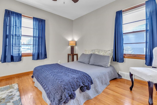 bedroom with hardwood / wood-style floors and ceiling fan