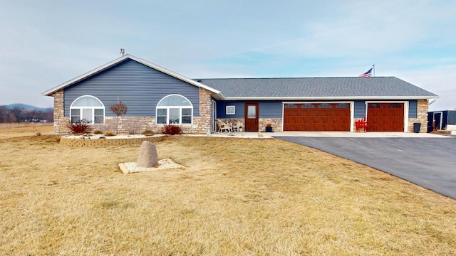 single story home with a front lawn and a garage