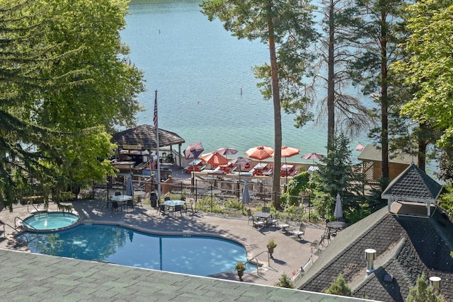 view of pool with a gazebo, a patio area, a water view, and a community hot tub