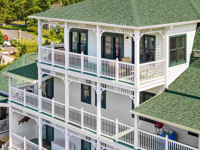 rear view of property featuring a balcony