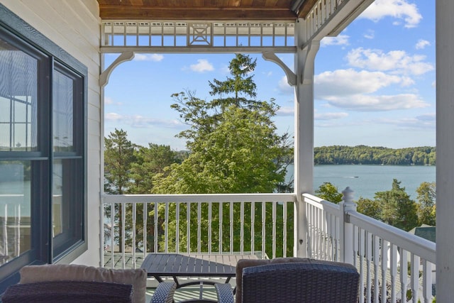 balcony featuring a water view
