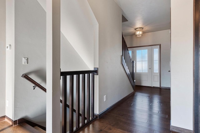 foyer with dark hardwood / wood-style flooring