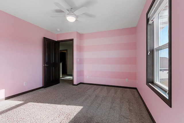 unfurnished room featuring carpet flooring and ceiling fan