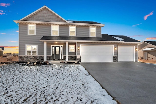 view of front of property with a garage