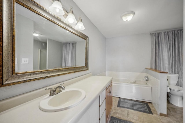 bathroom with vanity, a bath, and toilet