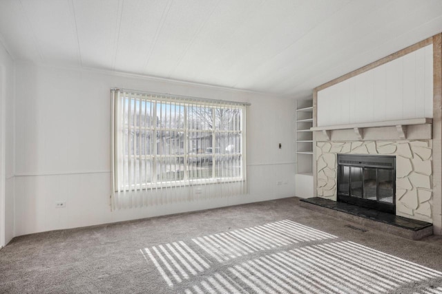 unfurnished living room with a fireplace and carpet floors