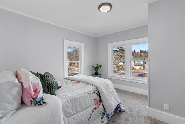 carpeted bedroom with ornamental molding