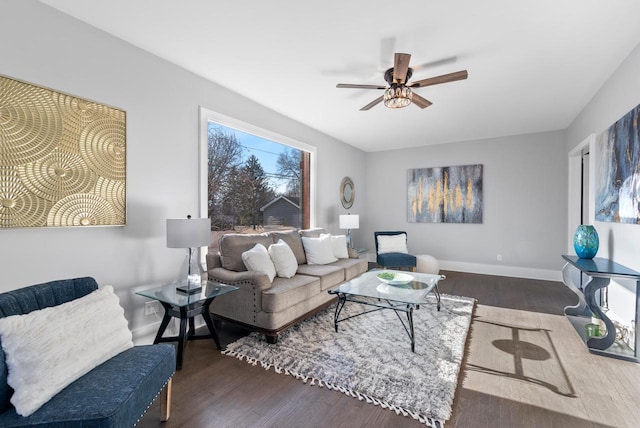 living room with ceiling fan and dark hardwood / wood-style flooring