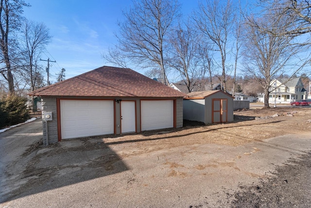 view of home's exterior featuring a shed and a garage