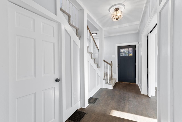 foyer entrance with dark hardwood / wood-style floors