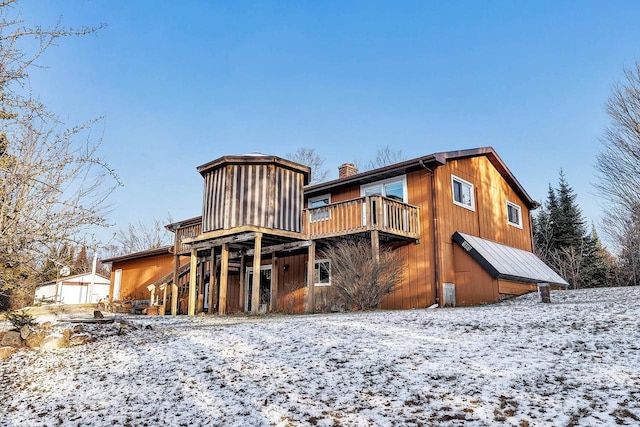 view of snow covered house