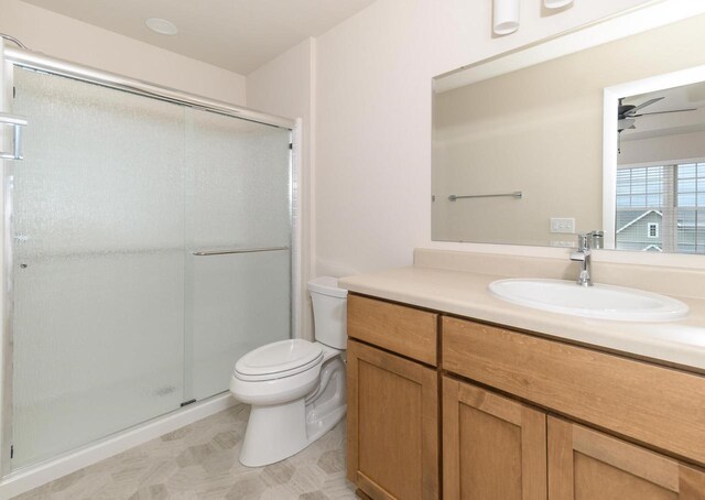 6407 Prairie Wood Dr, Mcfarland, WI 53558 - full bath with a shower stall, tile patterned floors, vanity, ceiling fan, and toilet