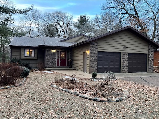 ranch-style home featuring a garage