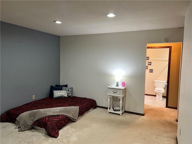 carpeted bedroom featuring connected bathroom