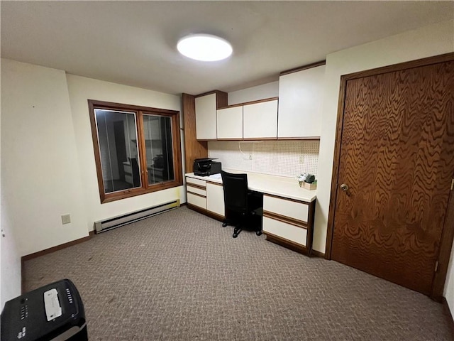 kitchen with baseboard heating, light carpet, and white cabinets