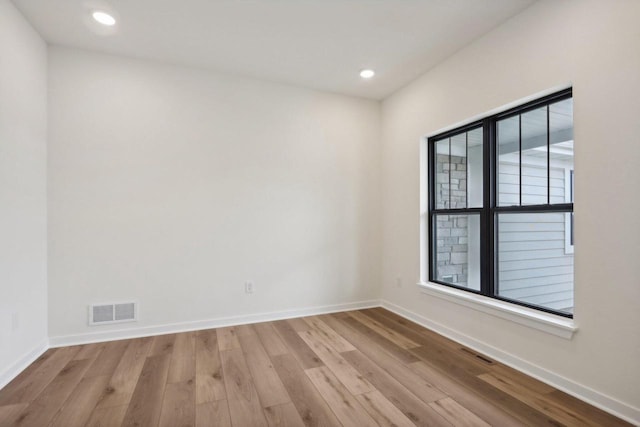 spare room featuring light wood-type flooring